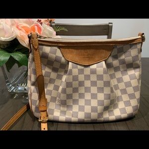 Authentic Louis Vuitton Siracusa crossbody bag.